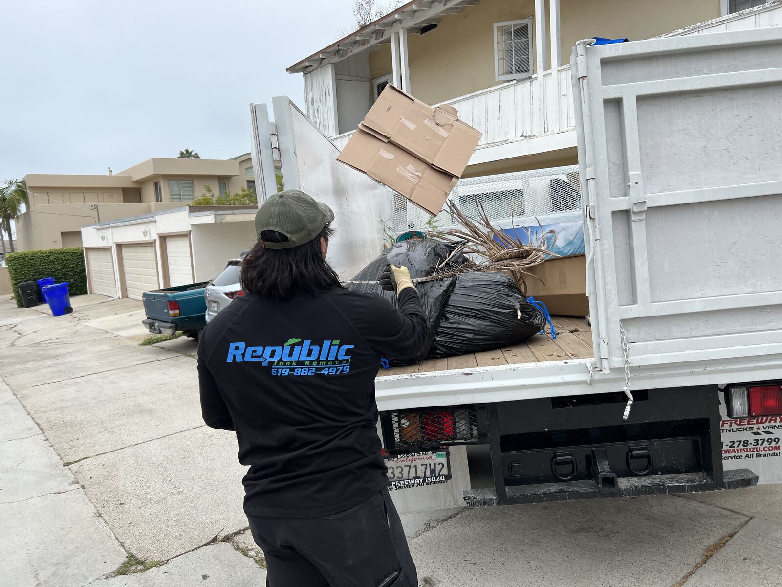 Republic crew loading debris into the truck