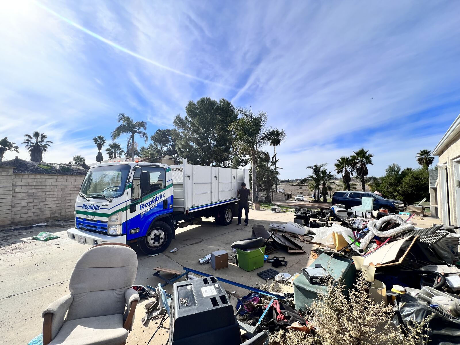 Republic Junk Removal truck in a San Diego neighborhood