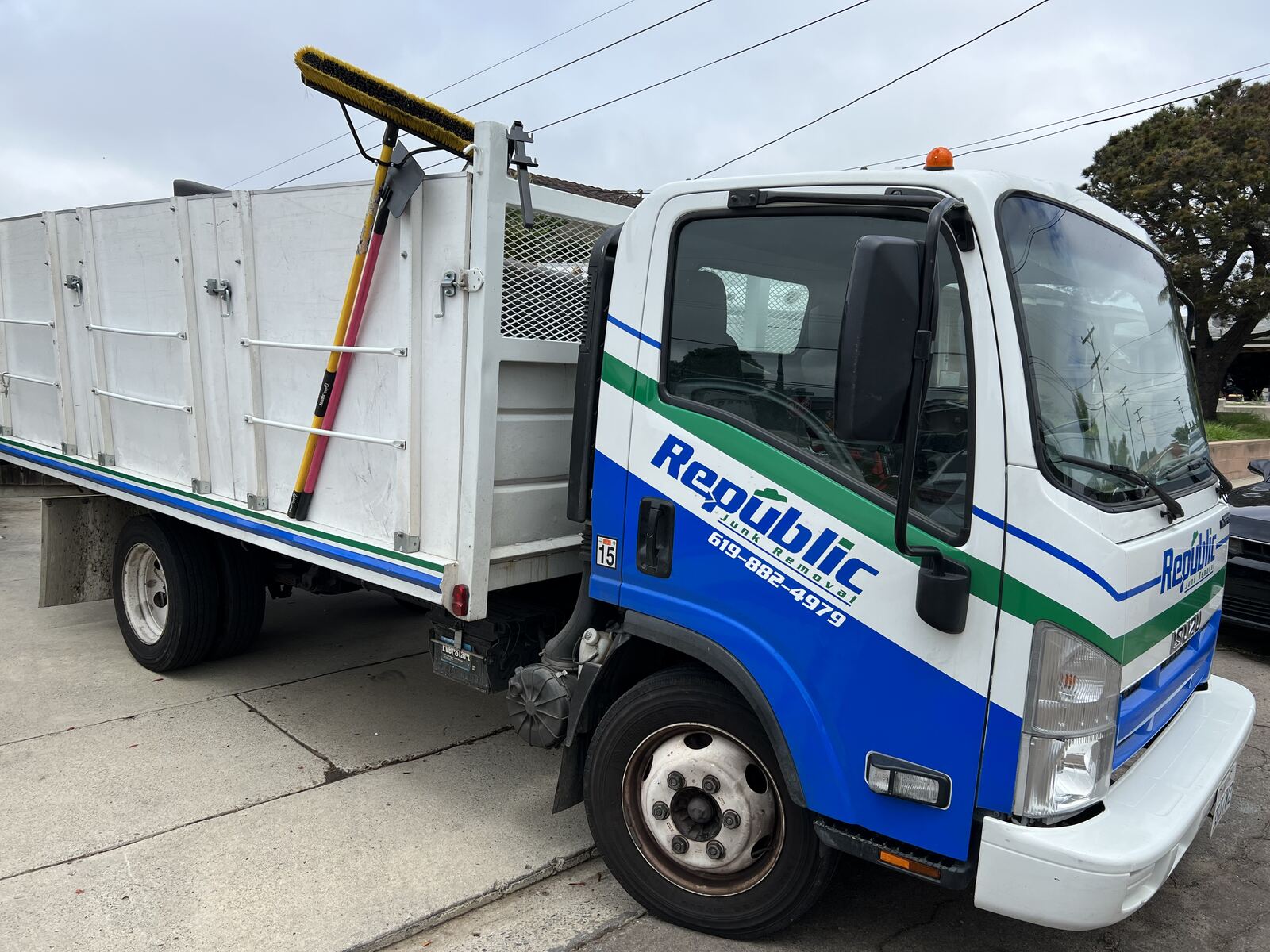 Republic Junk Removal truck loaded at a San Diego job site