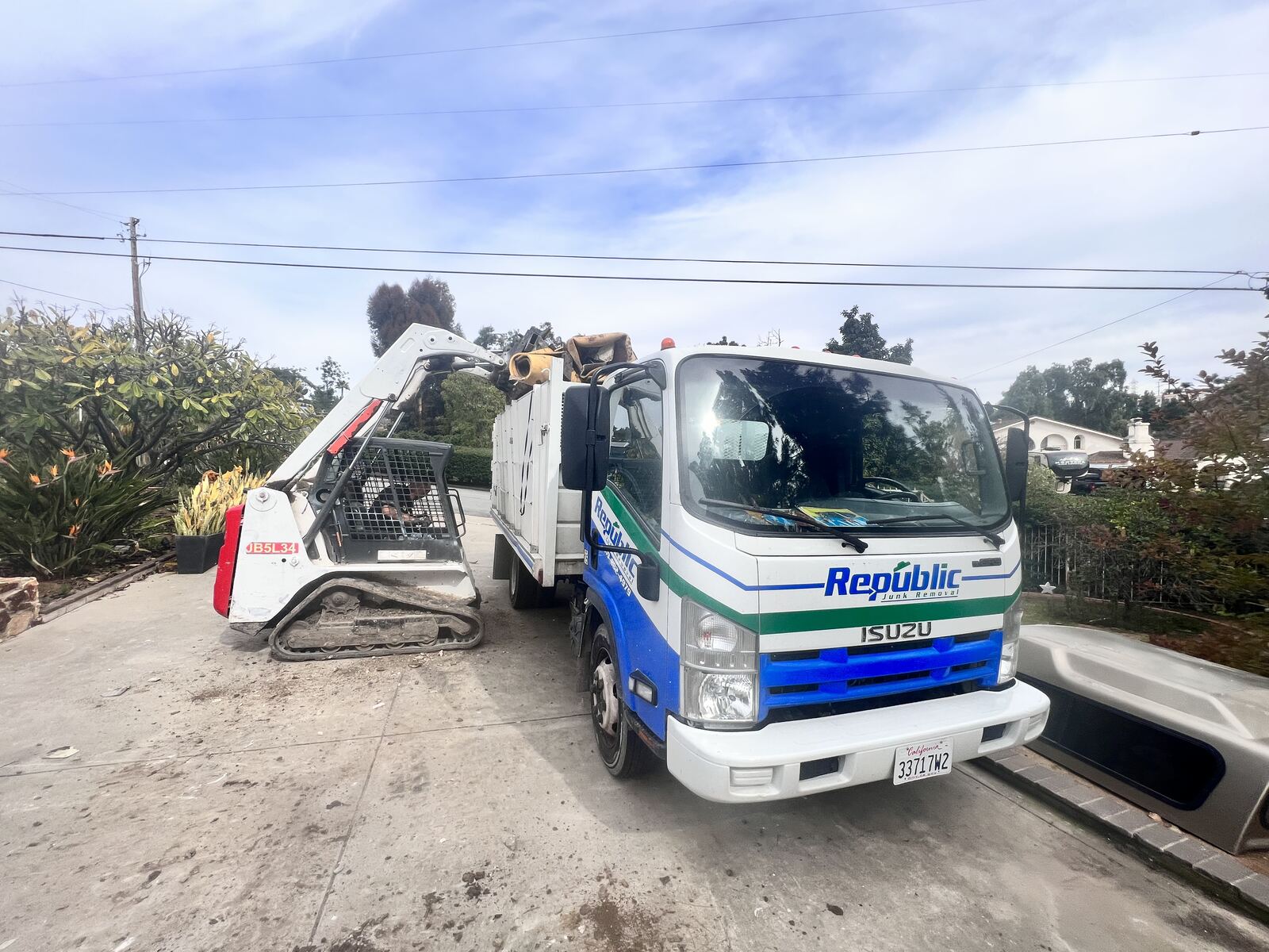 Republic truck with skid steer for larger San Diego jobs